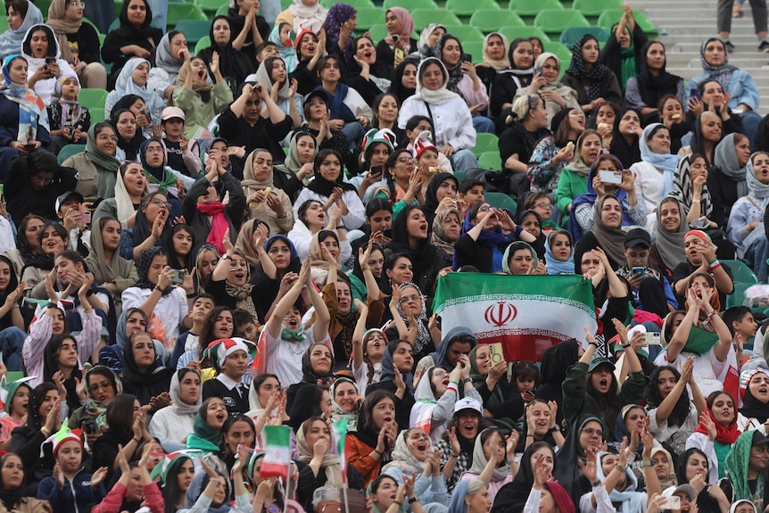 General view of Iran fans in the stands Majid Asgaripour, many holding national flags
