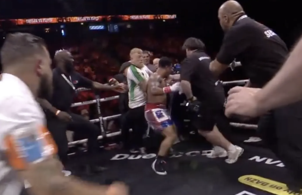 Anthony Taylor rushes at Matty Floyd