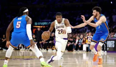 Los Angeles Lakers forward Rui Hachimura (in white) drives to the basket against Oklahoma City Thunder's Luguentz Dort (No. 5) and Chet Holmgren (No. 7) in Game Three of their NBA Western Conference Playoffs semi-finals series in May 9.