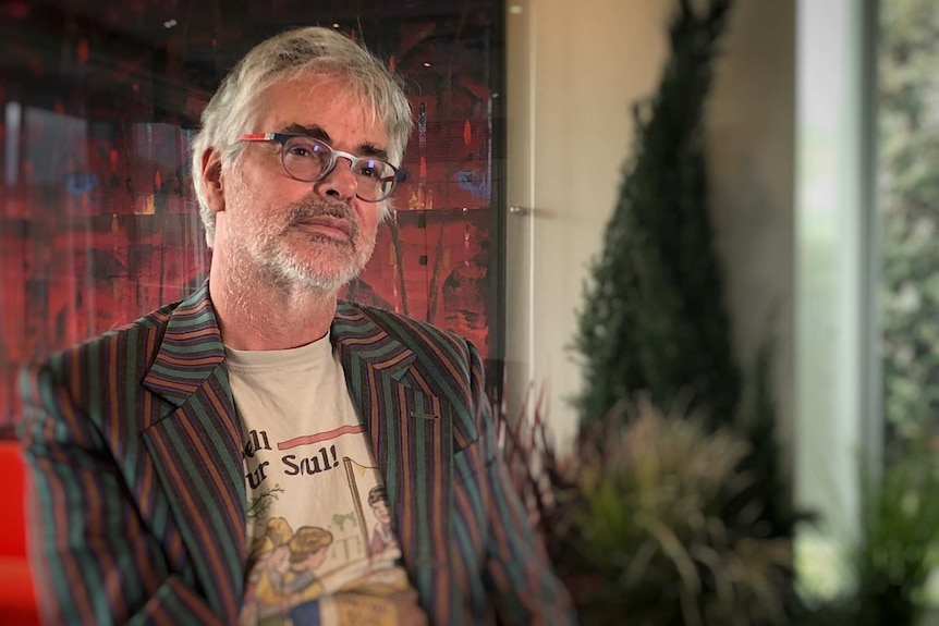 David Walsh looks off screen.