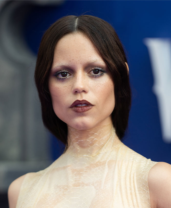 Young woman with dark hair and makeup emphasizing a thin, skeletonized look Young woman with dark hair and makeup emphasizing a thin, skeletonized look