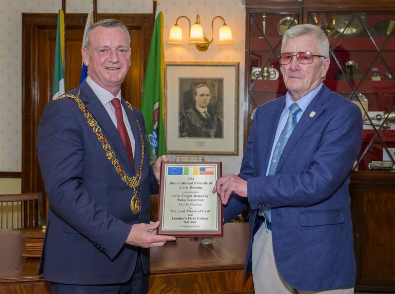 Lord Mayor Clr Fergal Dennehy is presented with a plaque by Dan O'Connell.