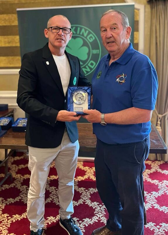 Boxing Ireland president Anto Donnelly receives an award from Munster Council president Ted Barry. Picture: Doug Minihane