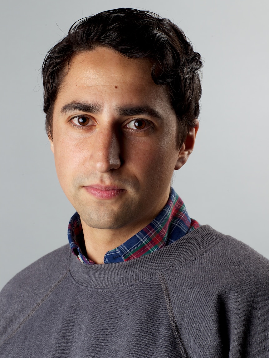 A middle-aged man with dark hair.