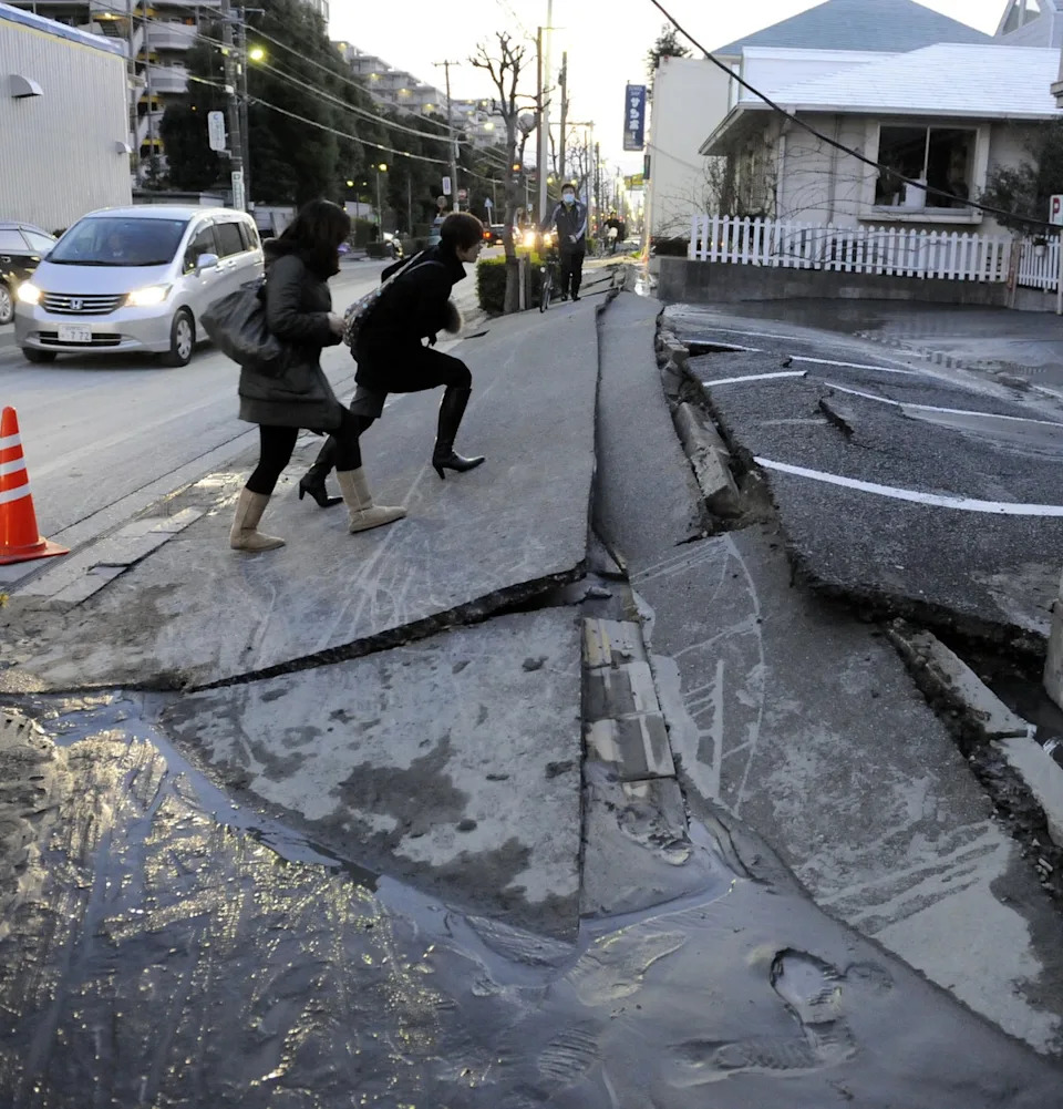 A pedestrian road has collapsed in the massive 8.9-magnitude earthquake (AFP via Getty Images)