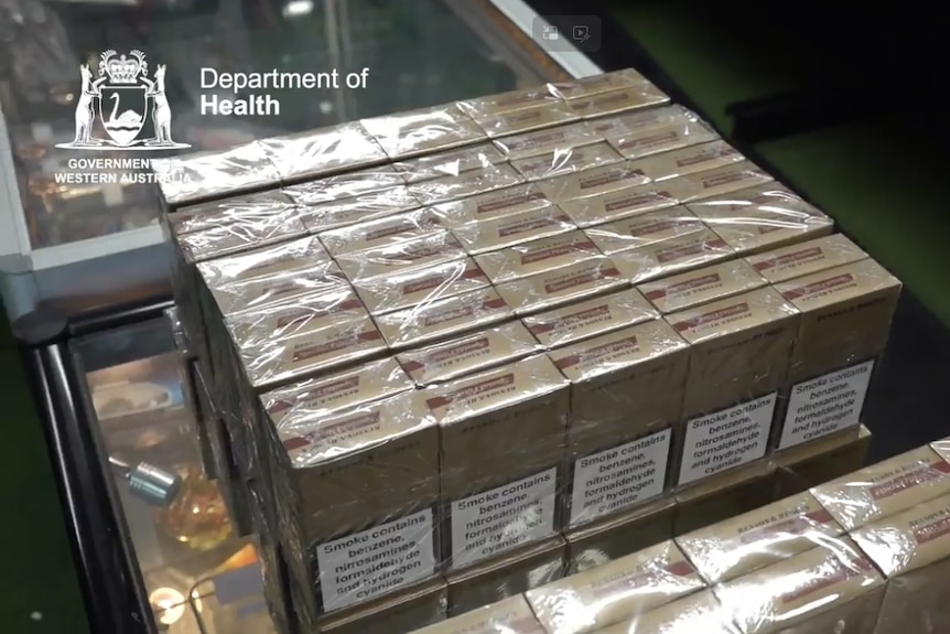Several packets of cigarettes in neat rows.
