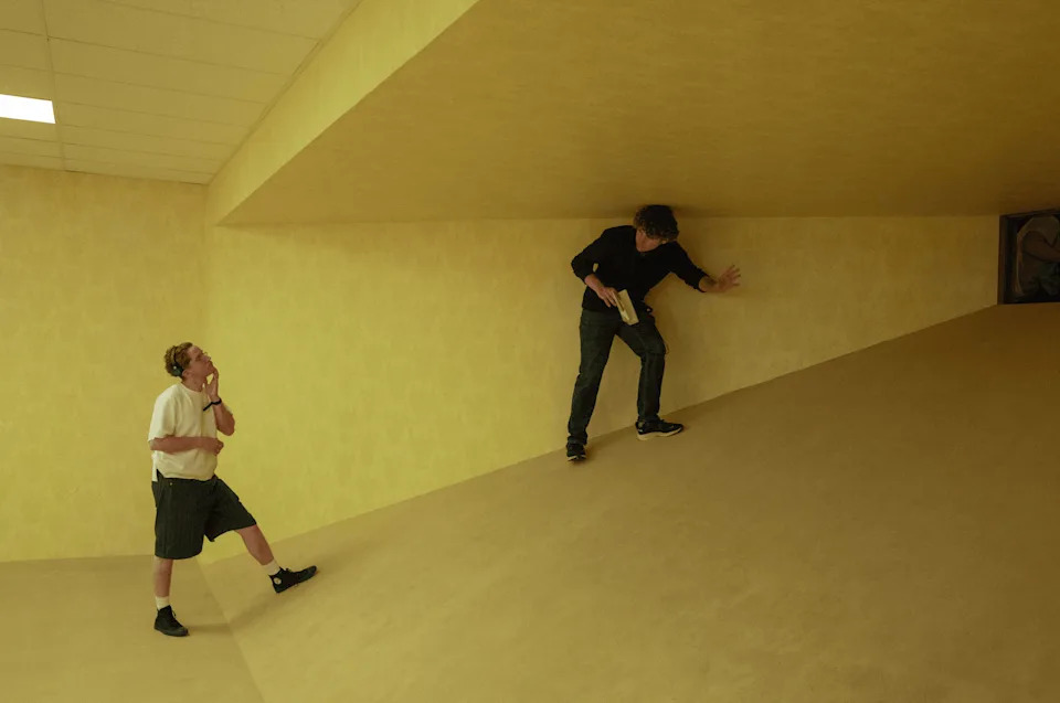 The yellow wallpaper may be the most important visual motif in the backrooms—Vermette found a local producer to create 40 product tests, with the end goal being an identical match to Parsons’s (right) YouTube videos. “The real test was to put your iPhone camera up and take a photo,” Vermette says. “If it felt like the Blender file, we know we won.”