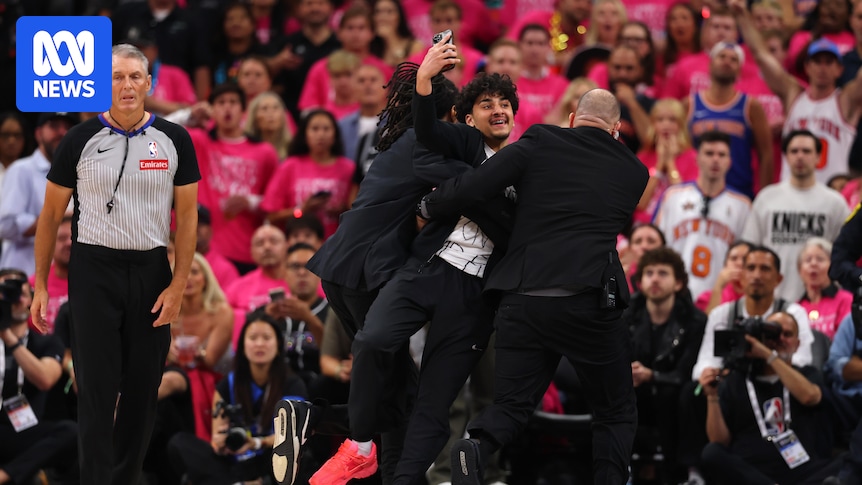 New York Knicks win NBA finals game one against San Antonio Spurs as fan invades court