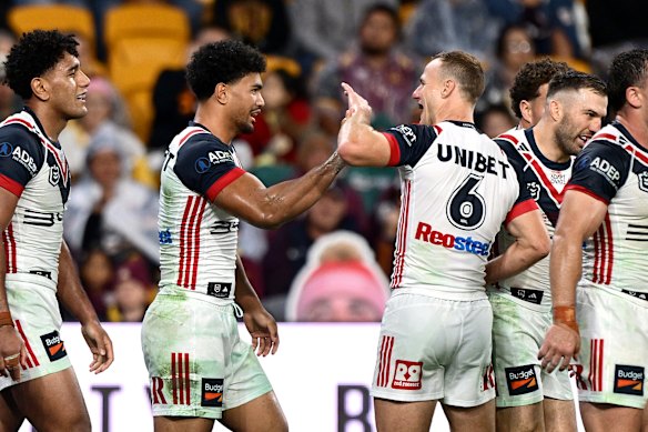 Robert Toia and Daly Cherry-Evans celebrate a late Roosters try.