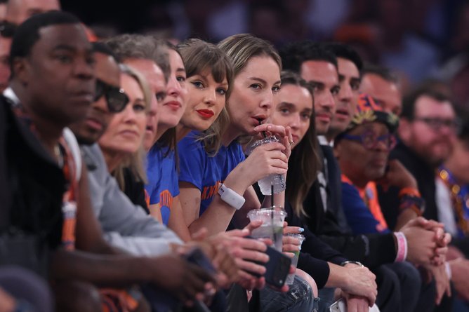 Taylor Swift smiles on.