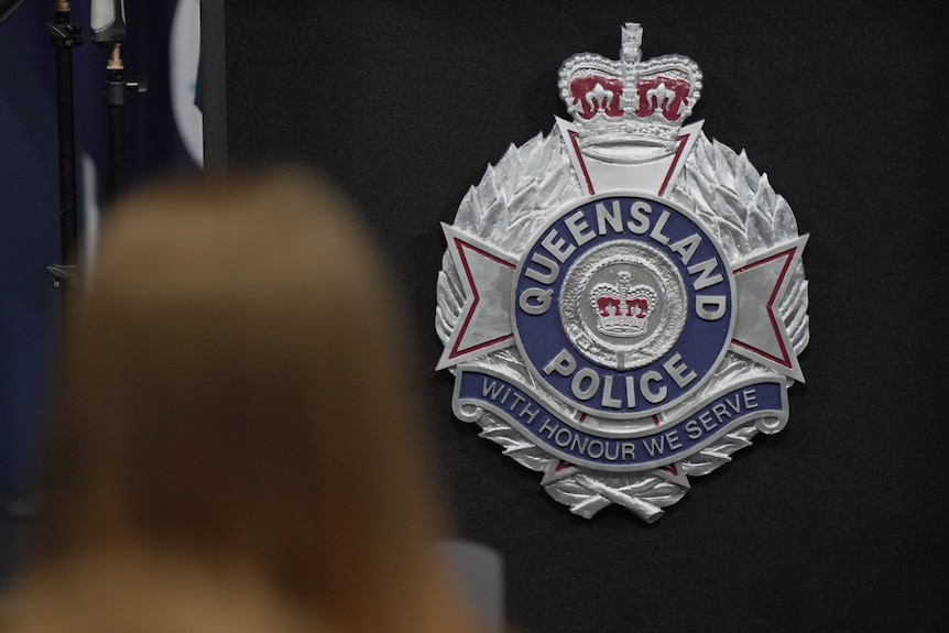 A generic QPS badge on the wall.