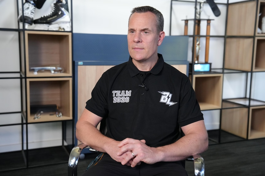 Ivan Rapchuk wearing a Brisbane Lightning polo shirt.