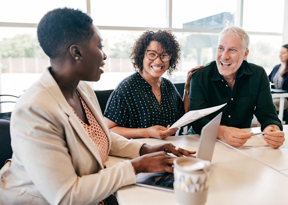 A couple discusses their finances with a financial planner.