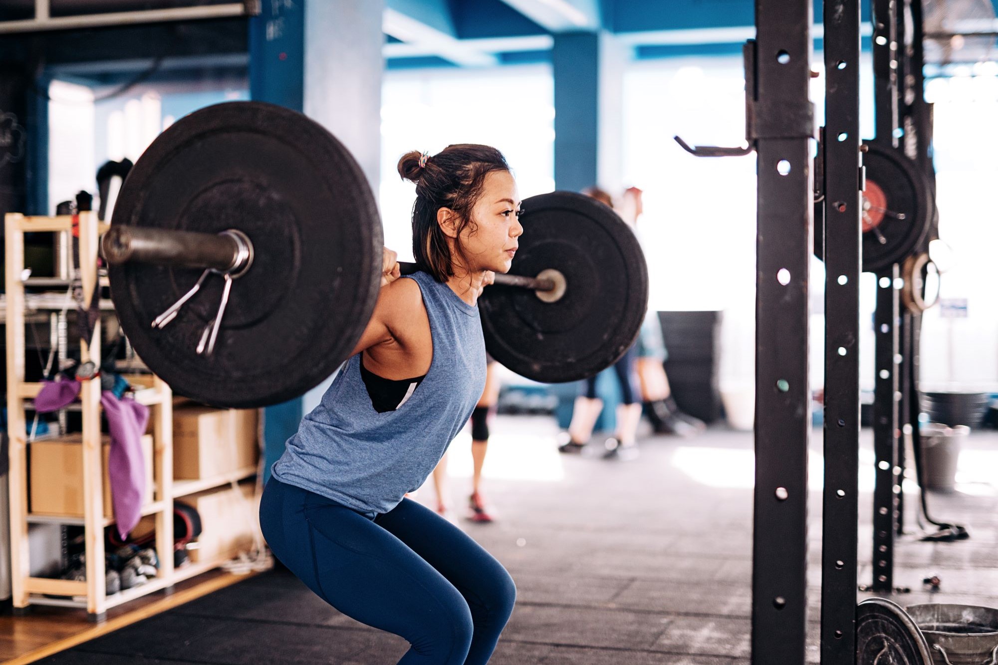 Photo of someone weight lifting in a gym
