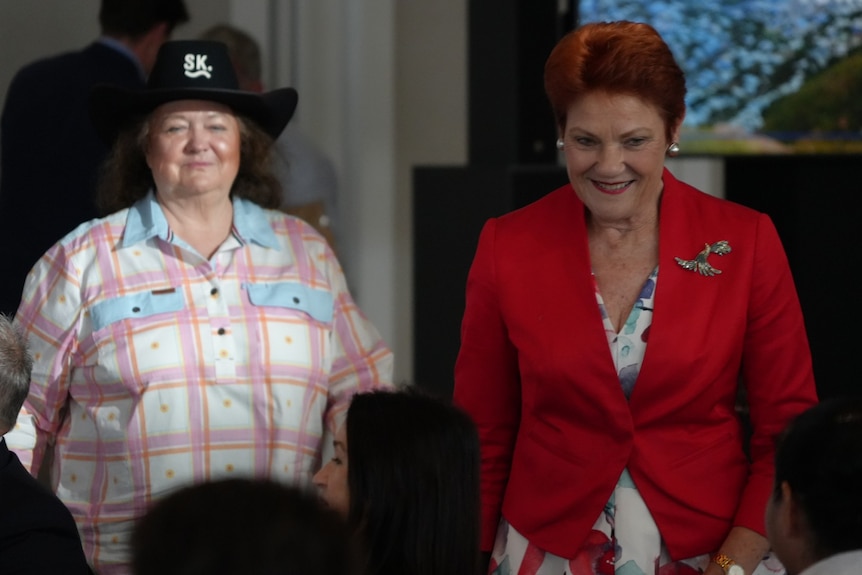 Two women on a stage.