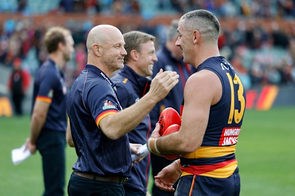 Matthew Nicks and Taylor Walker after the Crows’ hard-fought win over the Demons.