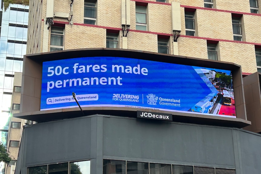a billboard saying 50 cent fares made permanent
