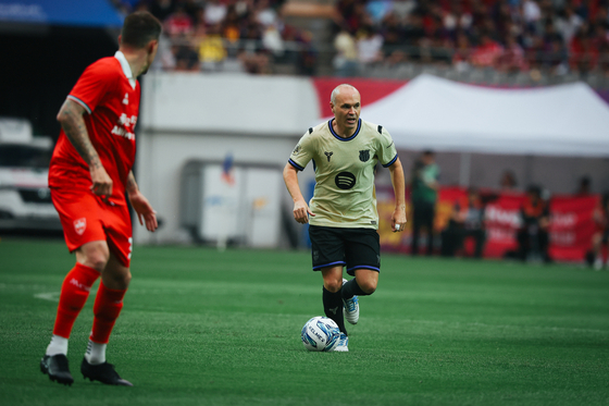 Barca Legends midfielder Andrés Iniesta plays the ball in the Champions Impact in Seoul 2026 match at Seoul World Cup Stadium in Mapo District, western Seoul, on June 6. [FC BARCELONA]