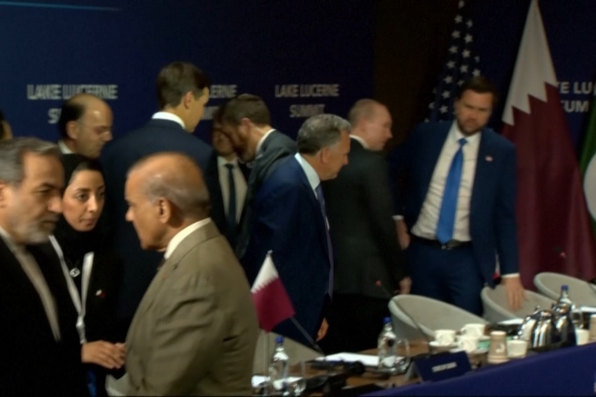 JD Vance is seen takling to officials as he watched the Iranian delegation walk out of the room.