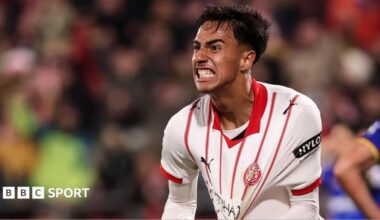 Vitor Reis celebrates scoring for Girona by pulling at his shirt