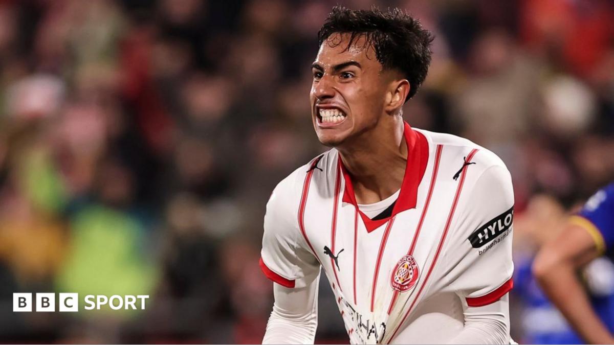 Vitor Reis celebrates scoring for Girona by pulling at his shirt