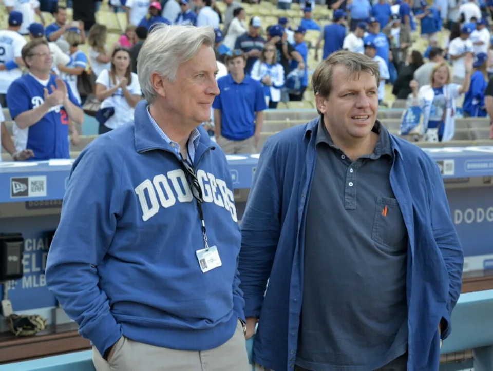 Los Angeles Dodgers chairman Mark Walter (left) and partner Todd Boehly attend the 2015 MLB opening day game against the San Diego Padres at Dodger Stadium. The Dodgers defeated the Padres 6-3.