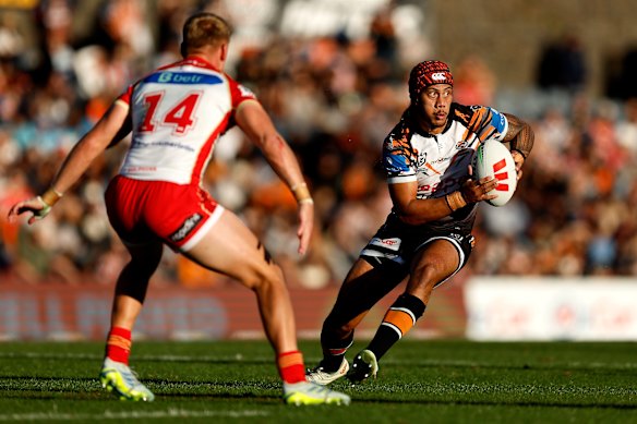 Jarome Luai tries to get something going for the Tigers in attack.