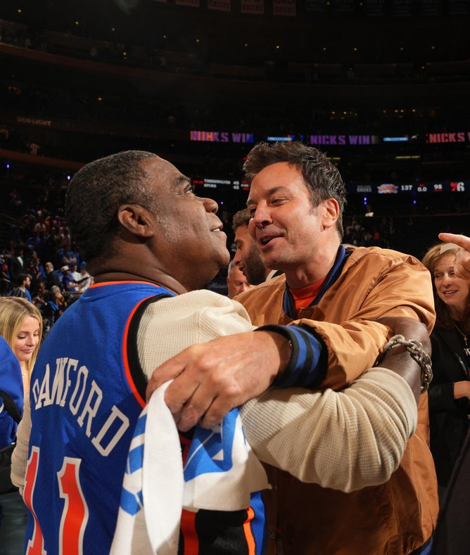 Tracy Morgan and Jimmy Fallon hug after the game between the Philadelphia 76ers and the New York Knicks during Round Two Game One on May 4, 2026 at Madison Square Garden in New York City, New York. 