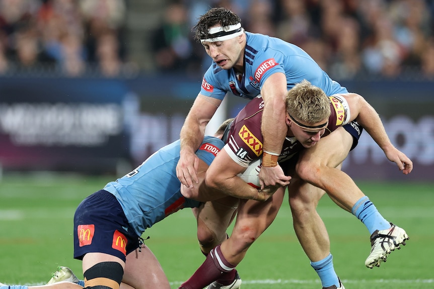 Max Plath runs the ball during an Origin match.