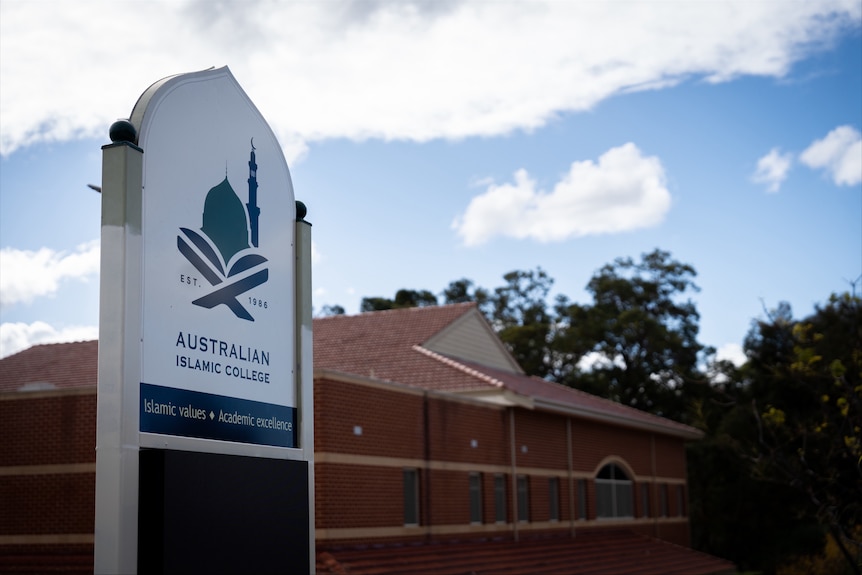 A red brick building with an 'Australian Islamic College' sign in front
