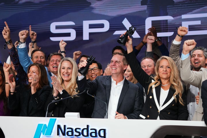 Gwynne Shotwell, President and COO of SpaceX, right, celebrates with colleagues during a bell ringing ceremony for the IPO of SpaceX at the Nasdaq MarketSite in New York, Friday, June 12, 2026, in New York. (AP Photo/Frank Franklin II)