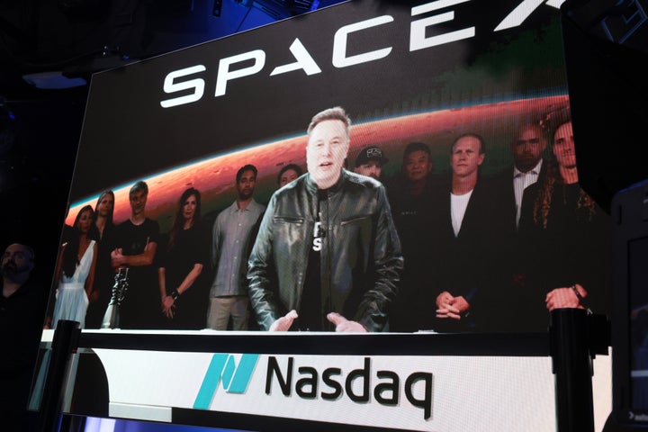 NEW YORK, NEW YORK - JUNE 12: SpaceX founder and CEO Elon Musk speaks via video at the Nasdaq Marketsite in Times Square during the launch of the SpaceX initial public offering (IPO) on the Nasdaq on June 12, 2026, in New York City. SpaceX, a rocket-making company, began trading Friday under the ticker SPCX following the largest initial public offering ever. Owner Elon Musk, who’s also CEO of Tesla and celebrated from a rocket launch site in Florida, is set to become the world’s first trillionaire. (Photo by Spencer Platt/Getty Images)