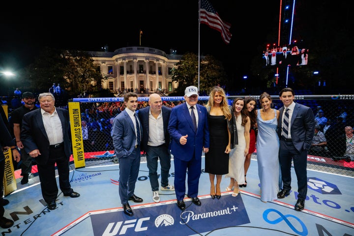 President Donald Trump; First Lady Melania Trump; Dana White, president of Ultimate Fighting Championship (UFC); and guests in the Octagon during the UFC Freedom250 fight on the South Lawn of the White House in Washington, D.C., on Monday.
