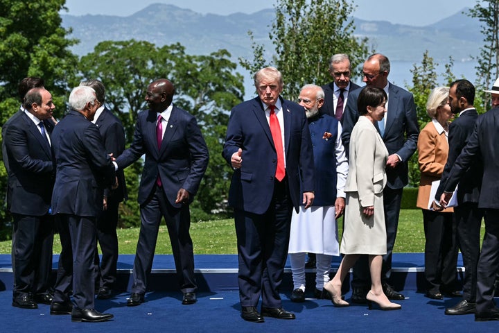 Trump poses during the G7 summit in France on Tuesday.
