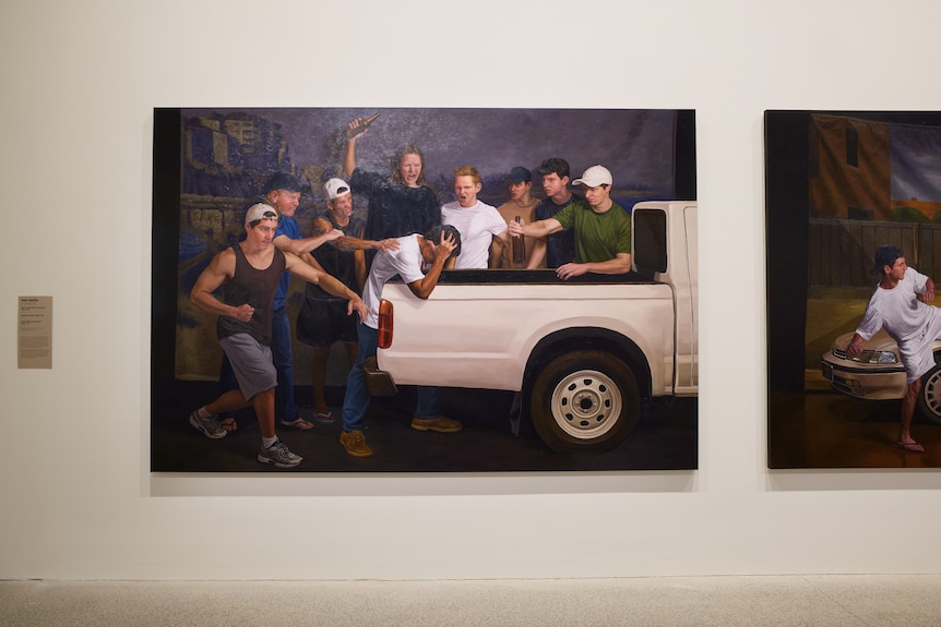 A painting depicting a group of angry white men attacking a dark-skinned man next to a white ute.