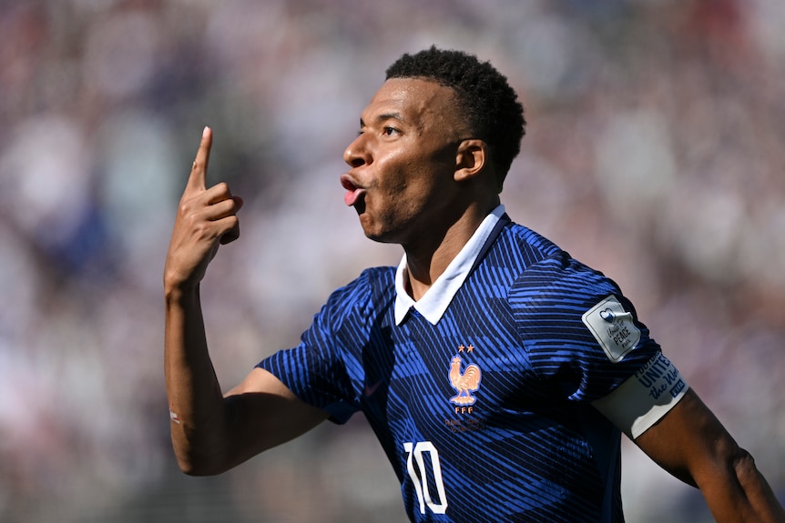 Kylian Mbappé celebrates