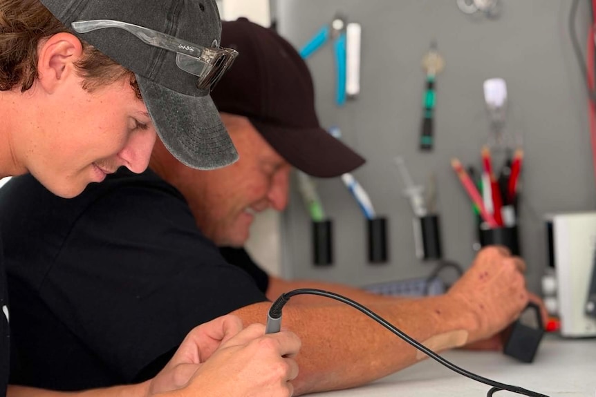 Two men working at a workshop
