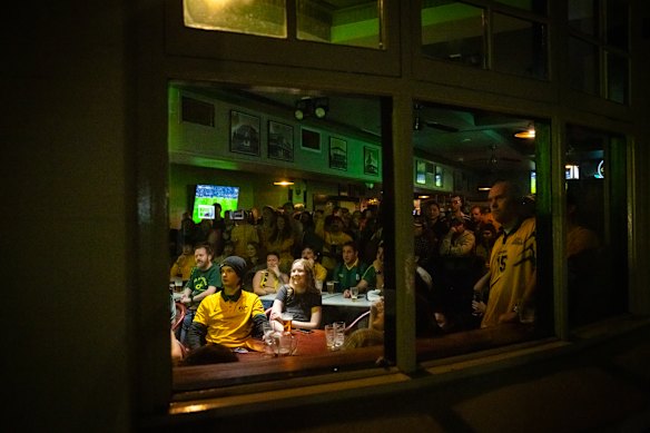 Fans watch the game at the Golden Barley pub.