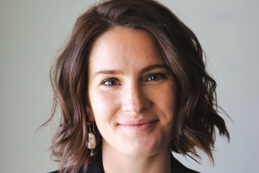 Anna Zenz, UWA Law School Lecturer smiles in a professional portrait.