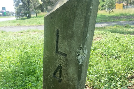 A picture of a concrete post with 'L4' inscribed