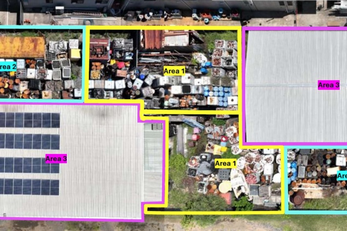 Aerial image of crowded site with waste and containers
