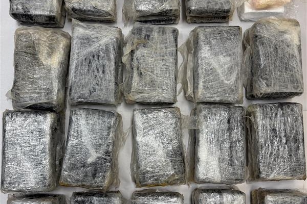 Packages wrapped in plastic, laid out on a table