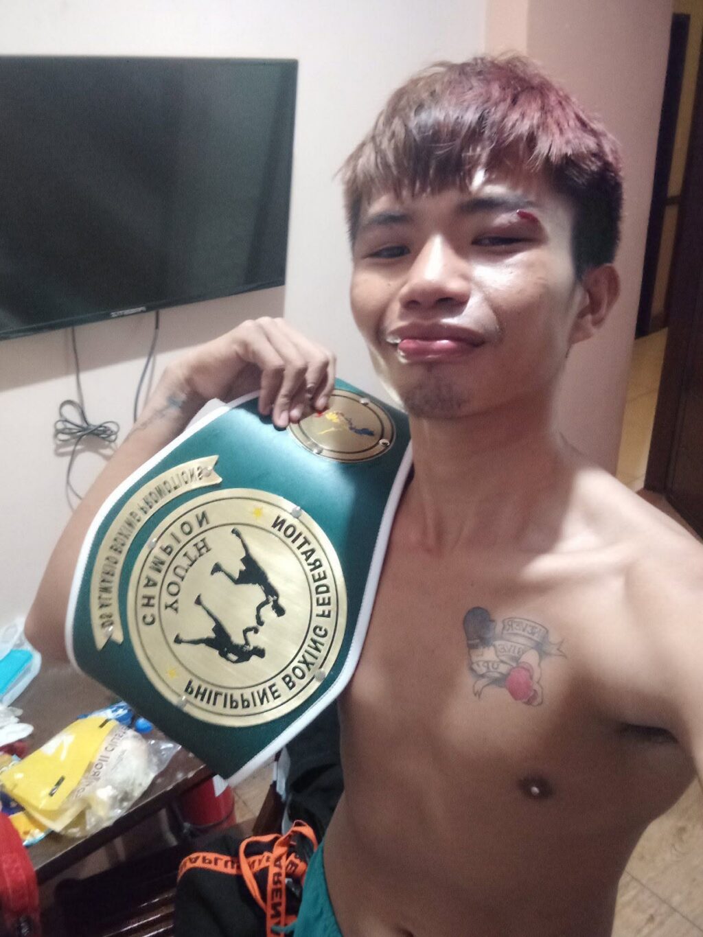 Rodelyn Perez shows the PBF belt. | Rodelyn Perez's Facebook page