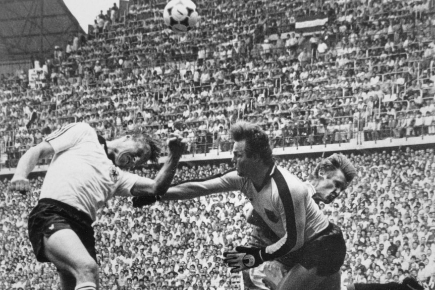 Friedrich Koncilia (right) duels with Horst Hrubesch