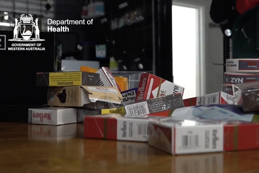 Several packets of cigarettes on a table.