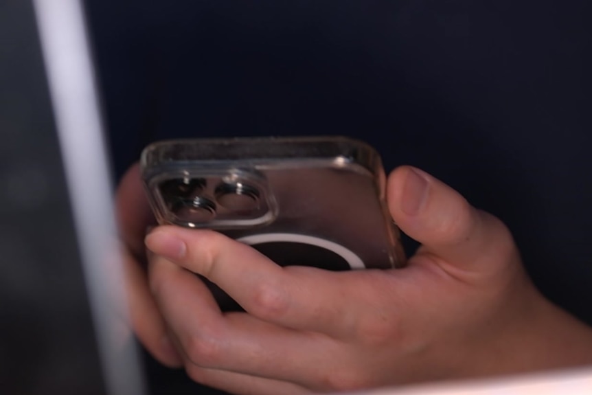 Close up of a man using his mobile phone.
