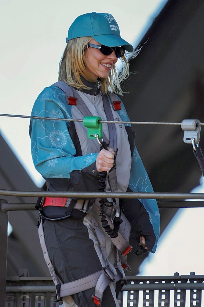 Sydney Sweeney climbing the Sydney Harbour Bridge.