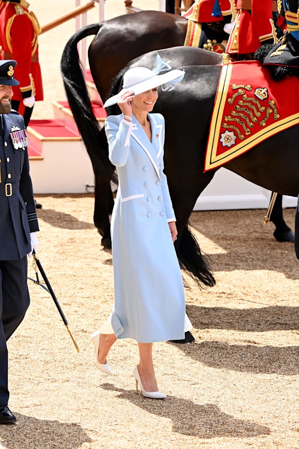 The Princess of Wales opted for a light blue coat dress with white trim by Catherine Walker, and a matching Philip Treacy hat for the occasion.