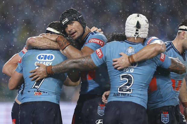 Stephen Crichton and the NSW Blues celebrate a try.