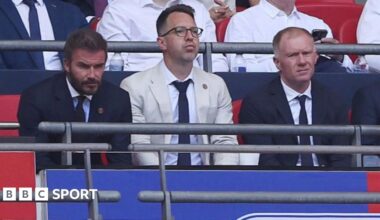 Salford co-owner David Beckham (left) and football director Paul Scholes sit either side of chief executive Gavin Fleig at Wembley
